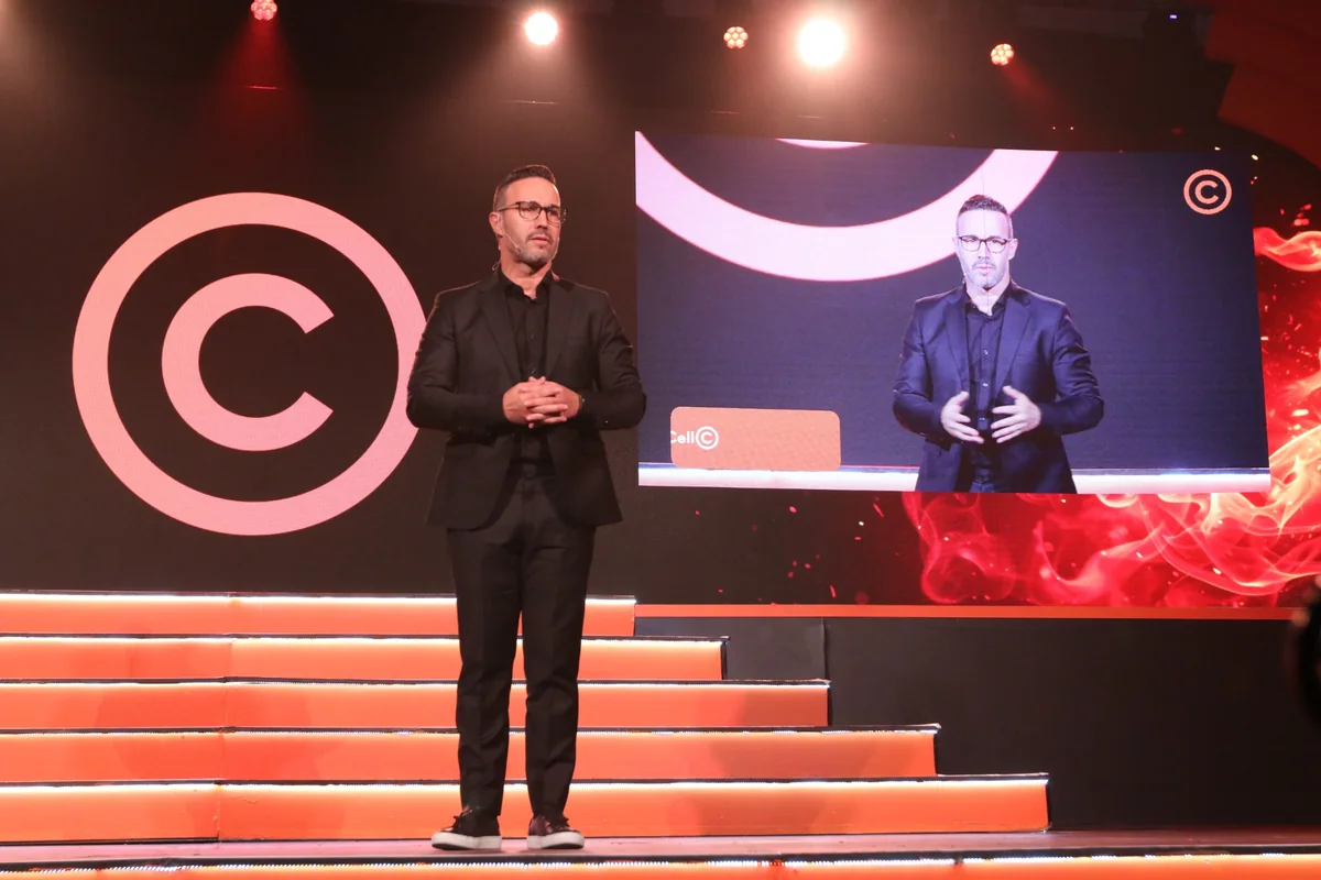 Business speaker on a branded stage
